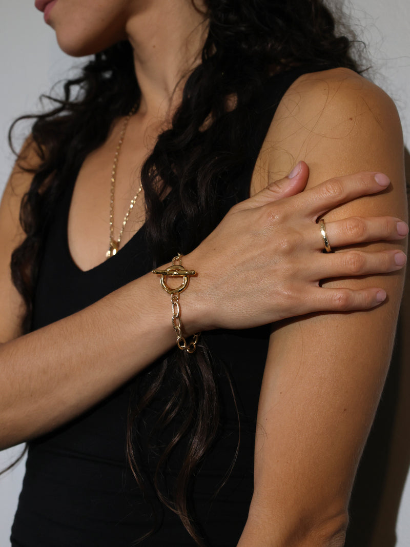 A model wears the Spes Ring in Recycled 10k yellow gold by Bexon Jewelry