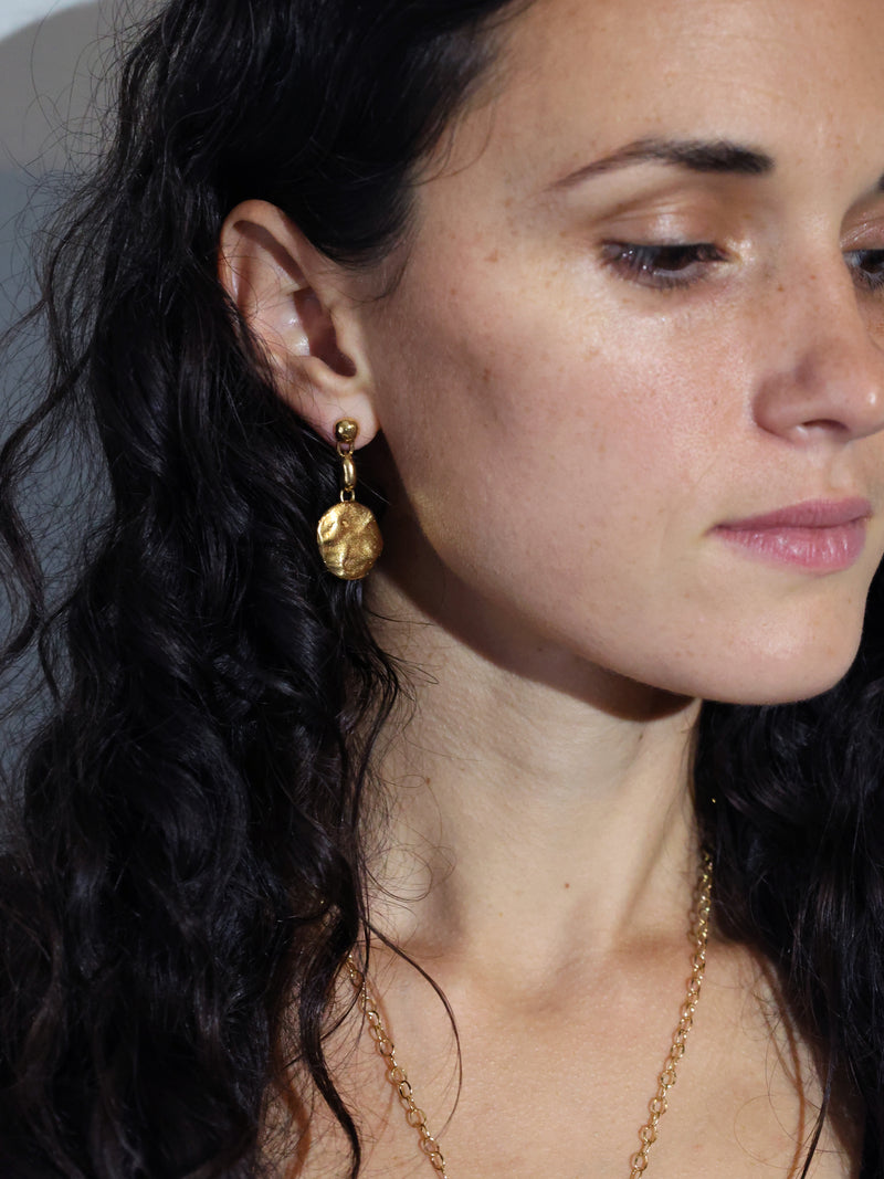 A model wears the Consum Drop Earrnings in Gold Vermeil by Bexon Jewelry 