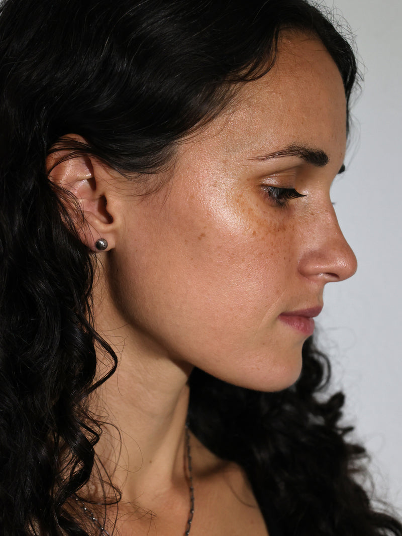 Model wearing the Diem Stud Earrings in Recycled Sterling Silver by Bexon Jewelry